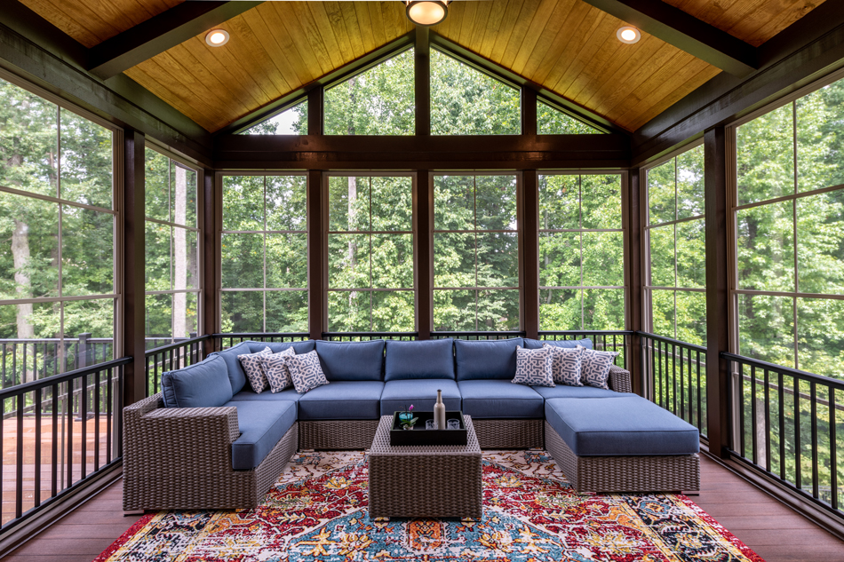 Newly-Furnished-Porch-Enclosure-1333652574 New modern screened porch with patio furniture, summertime woods in the background.
